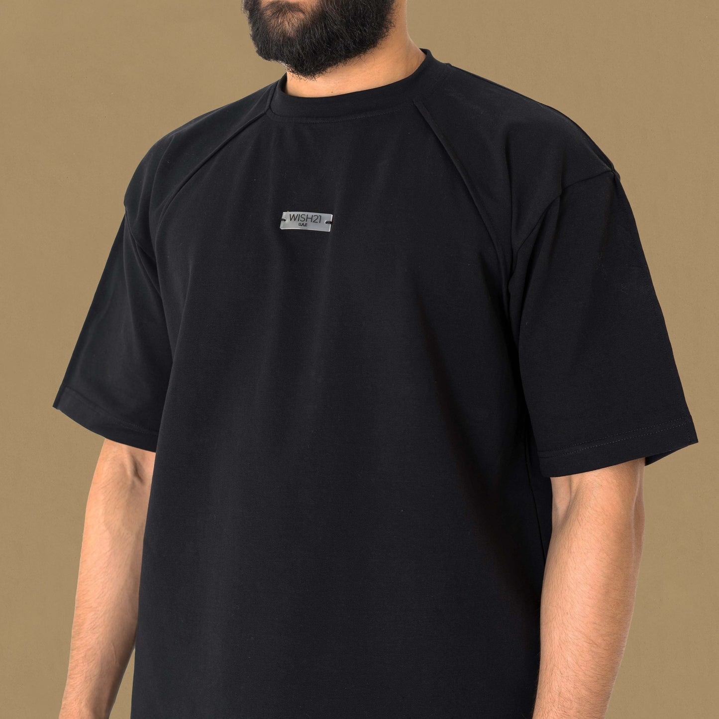 OVERSIZED T-SHIRT , BRAND NAME ENGRAVED ON PLASTIC IN THECHEST