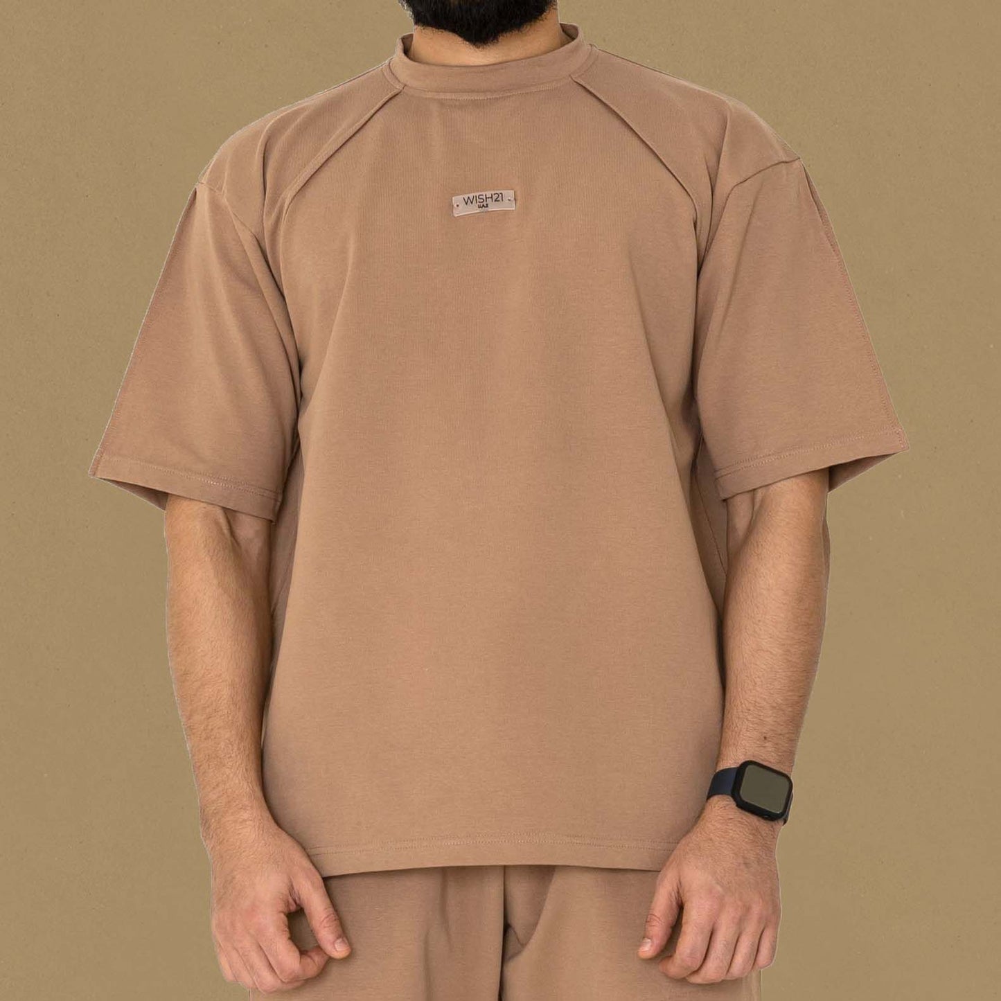 OVERSIZED T-SHIRT , BRAND NAME ENGRAVED ON PLASTIC IN THECHEST